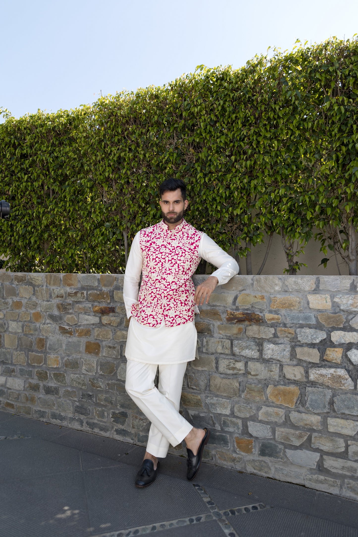The white and pink bundi set, crafted from luxurious silk fabric,