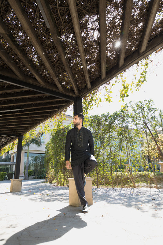 The black kurta pyjama, crafted from luxurious Tussar silk fabric
