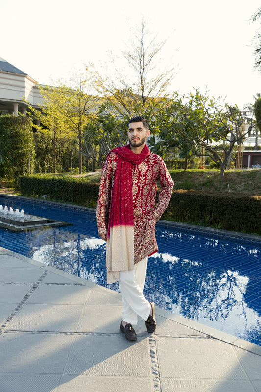 The maroon kurta and pyjama, crafted from smooth georgette fabric.